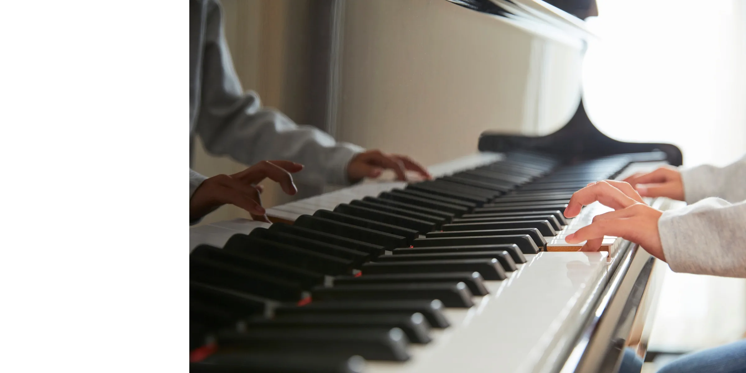 Hands at a piano keyboard